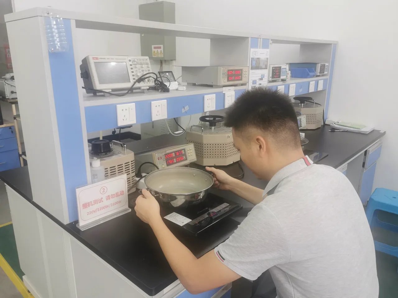 Engineer testing appliances in the QC laboratory